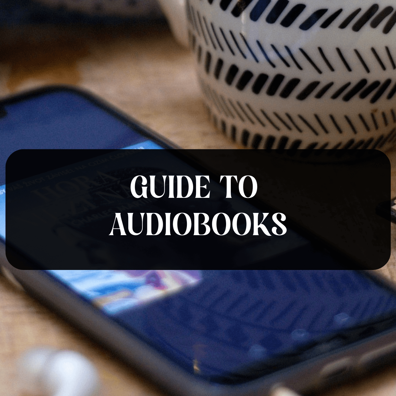 Guide to Audiobooks title with a cellphone in the background