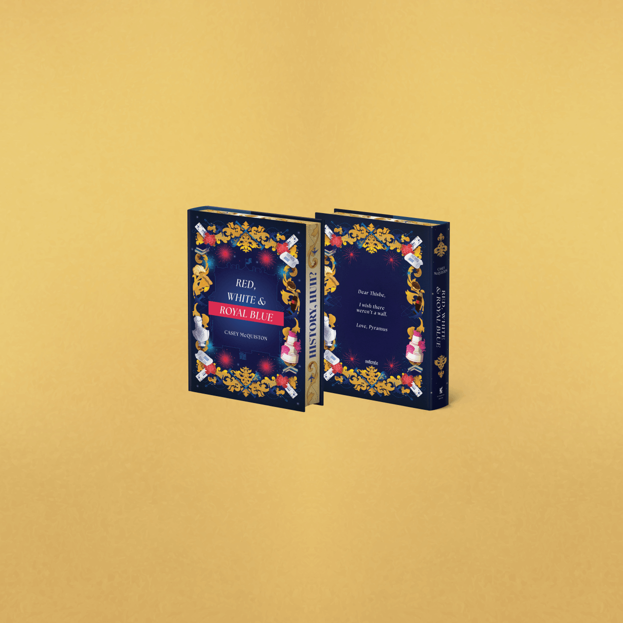 OwlCrate limited edition of Red, White and Royal Blue. Front and back cover centered on a gold background, with ornamentals framing the borders.