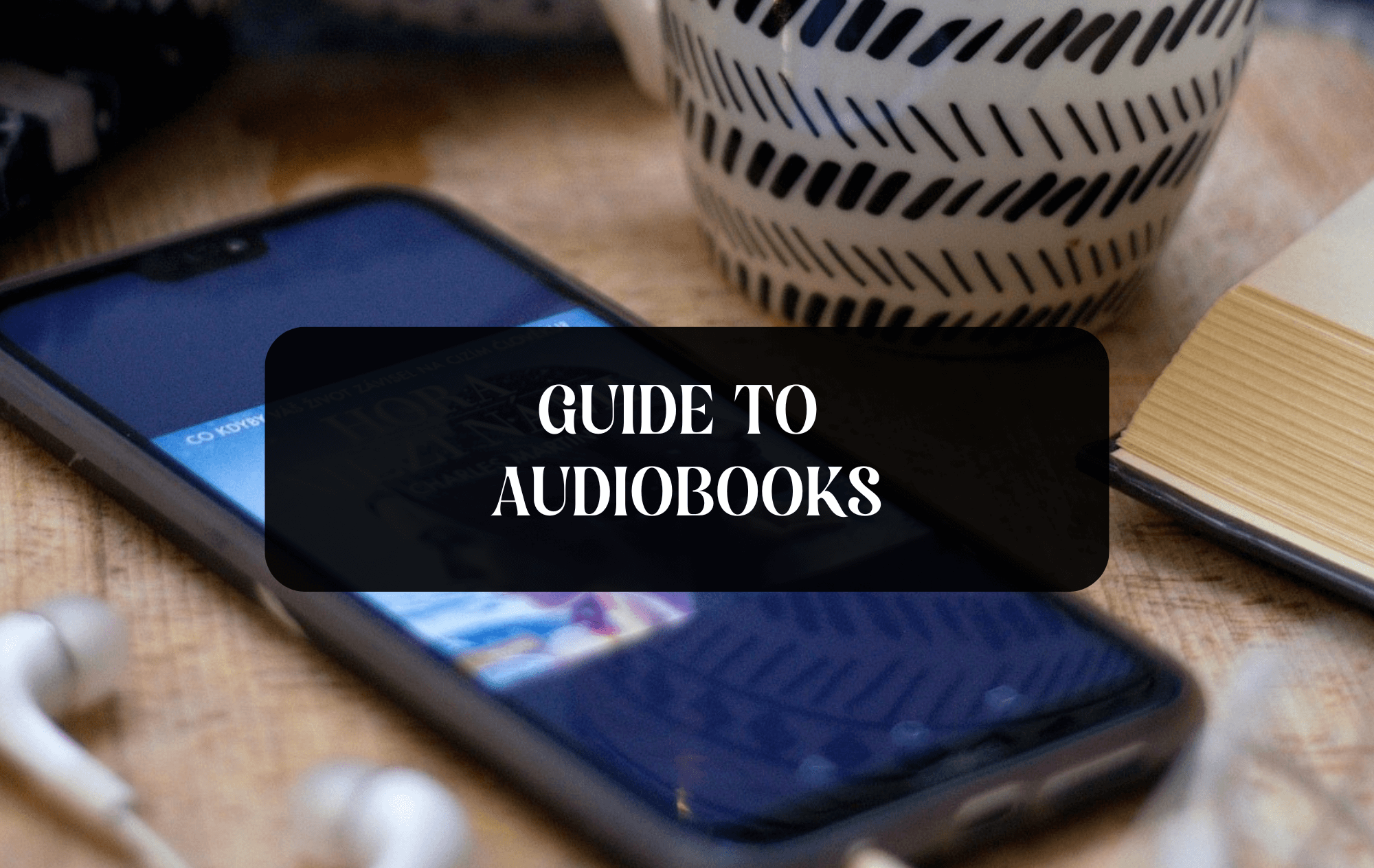 Guide to Audiobooks title with a cellphone in the background