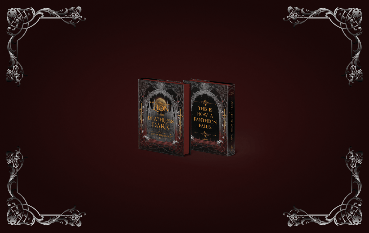 OwlCrate limited edition of The Lion and the Deathless Dark book by Carissa Broadbent. Front and back covers centered on dark red background with silver ornamental decorations framing the edges.