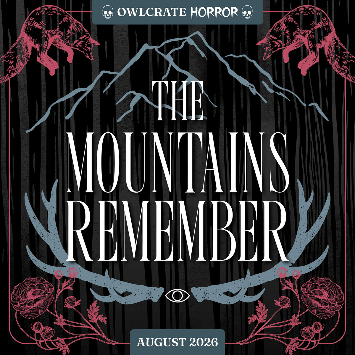 OwlCrate Horror August 2026 theme, The Mountains Remember. Illustrated mountains, antlers, foxes in mid-pounce, and flowers are featured over top a black and grey illustrated forest background. 